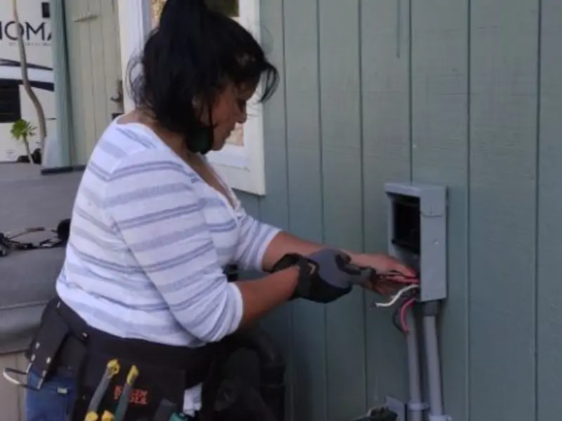Licensed electrician wiring an exterior subpanel in Port Royal